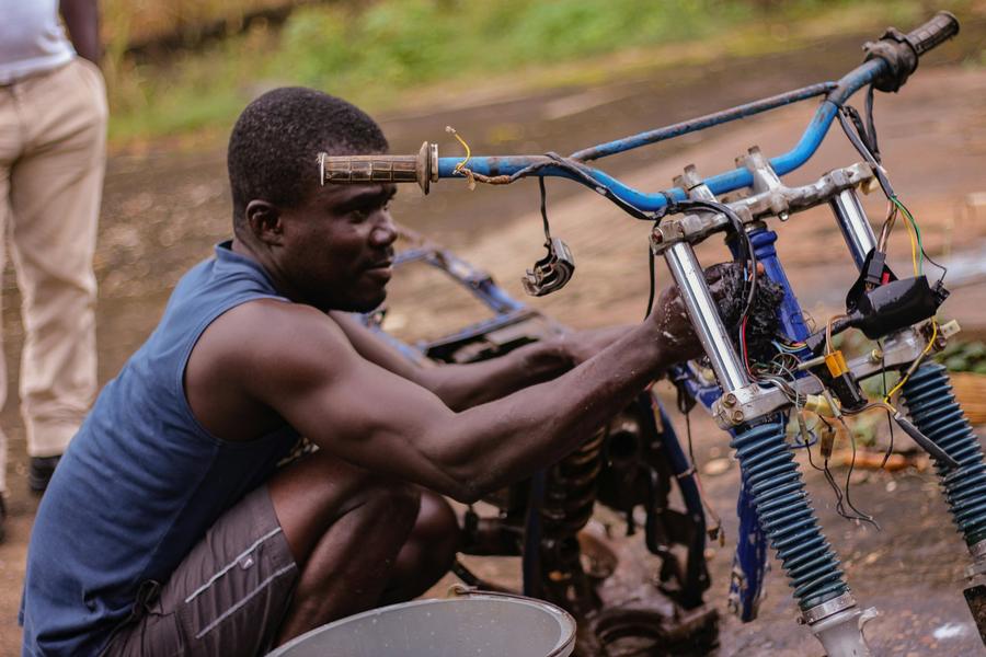 man fixing a bike