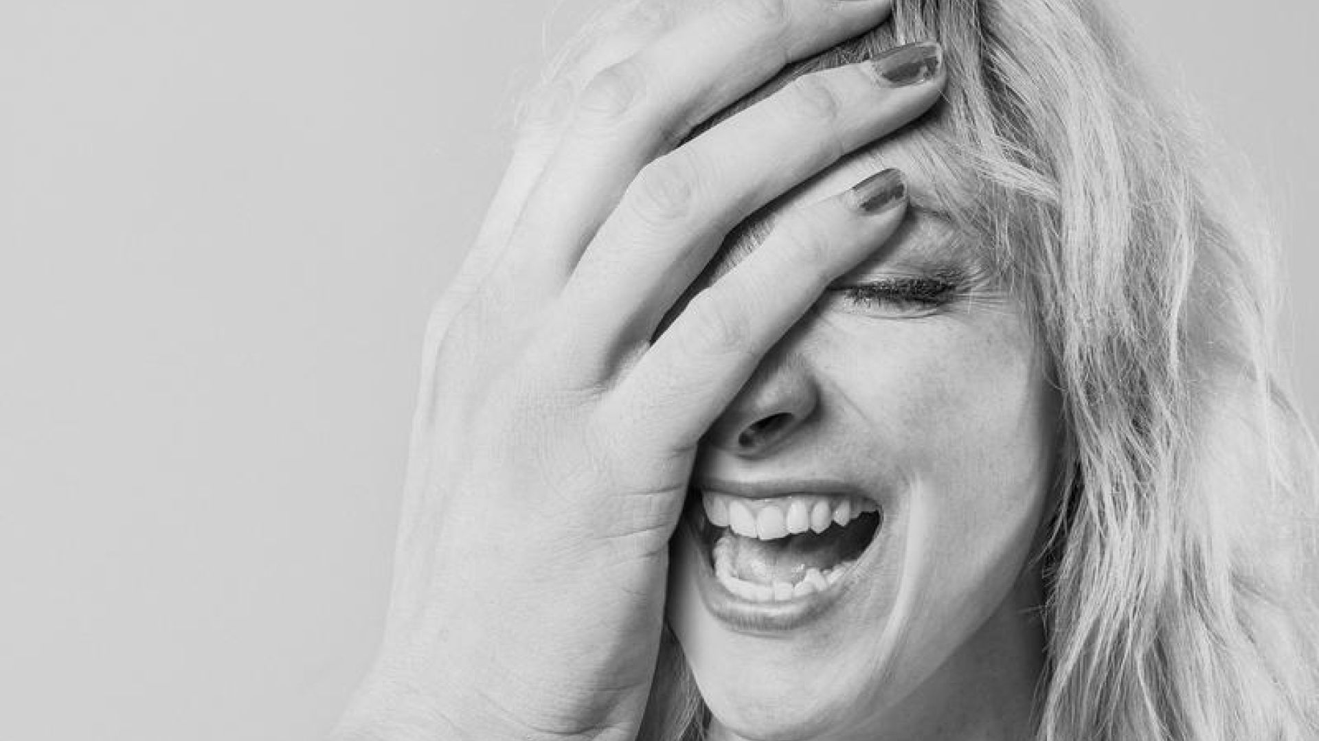 Woman With Absurdly Large Hand Laughing