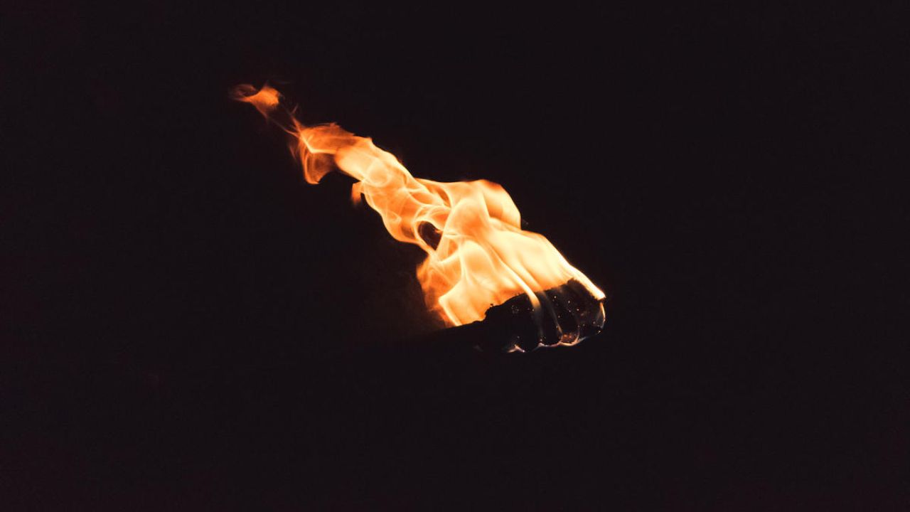 Fire torch in the darkness