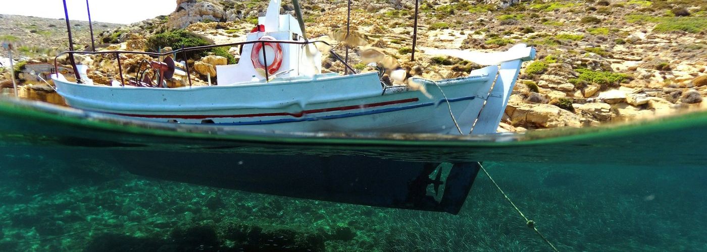 a boat waterline, underwater and above water, by land