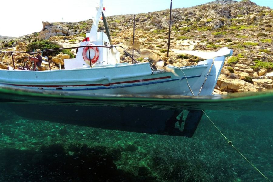 a boat waterline, underwater and above water, by land