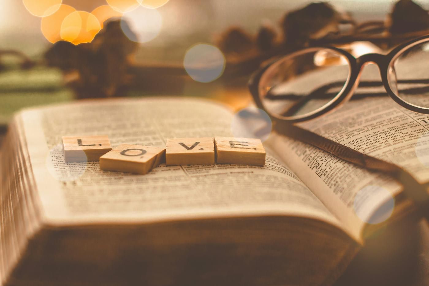 love letters on the bible on a desk with glasses